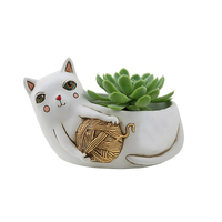 White CAT with yarn planter